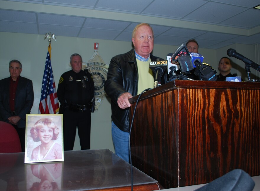 Former Sheriff John York speaks beside a photo of Tammy Jo Alexander