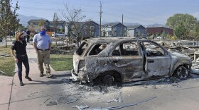 Oregon Governor Kate Brown tours damage caused by the Almeda Fire in Talent, accompanied by Incident Commander Scott Magers, with the state Fire Marshal's Office on Sept. 21, 2020.
