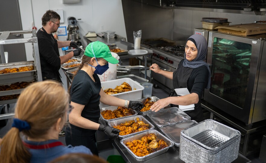 Volunteers prepared Thanksgiving meals for Cleveland's immigrant community who lost access to federal food supplements.
