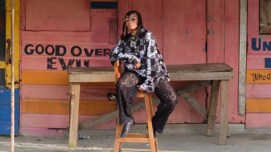 a woman posing for a photo on a chair 