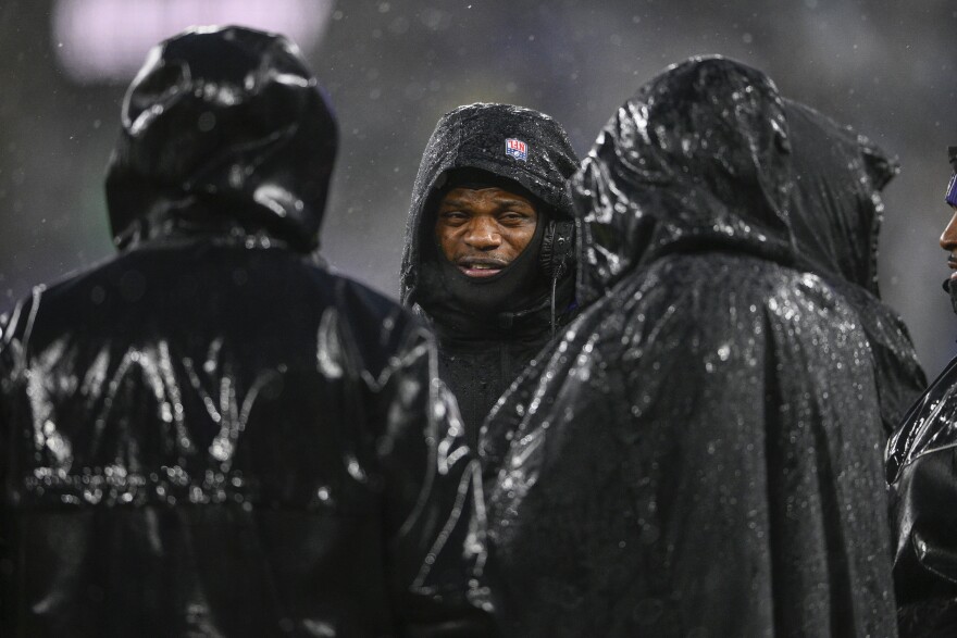 Baltimore Ravens quarterback Lamar Jackson stands on the sidelines with teammates during the first half of an NFL football game against the Pittsburgh Steelers, Saturday, Jan. 6, 2024 in Baltimore. (AP Photo/Nick Wass)