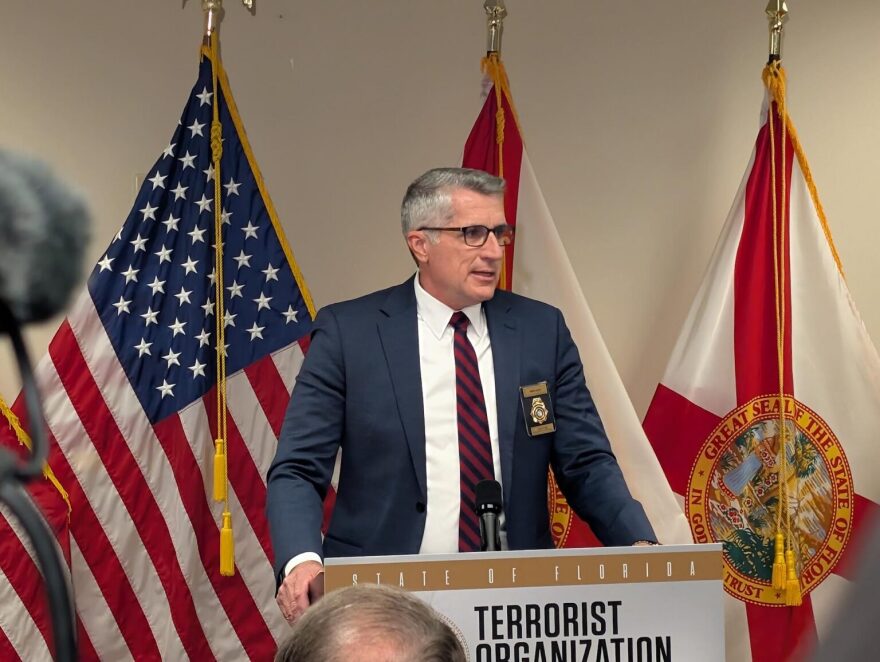 FDLE Commissioner Mark Glass speaking in Tampa on July 1, 2026.