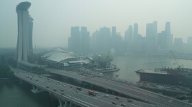 A thick haze obscures the skyline behind the Central Business District area in Singapore, Friday, Oct. 9, 2026. (AP Photo/David Hu)