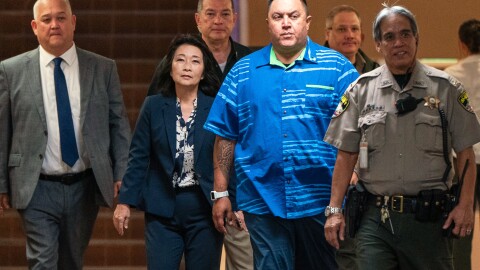 Lt. Gov. Sylvia Luke, second from left, arrives for a court appearance at Kaʻahumanu Hale, accompanied by her attorney and security detail in Honolulu, Thursday, July 30, 2026.