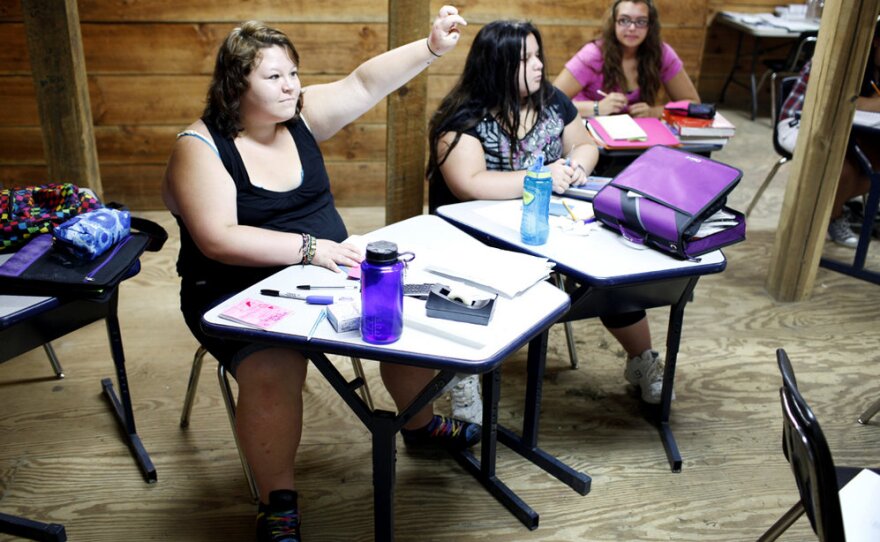 Academics are rigorous at Wellspring. Here, students sit in a math class on campus. With a maximum campus enrollment of 50 students, class size is generally very small.