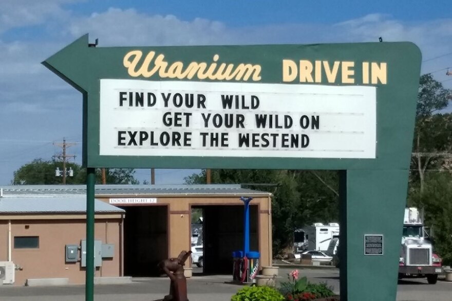 An old movie drive-in sign encourages visitors to explore the region