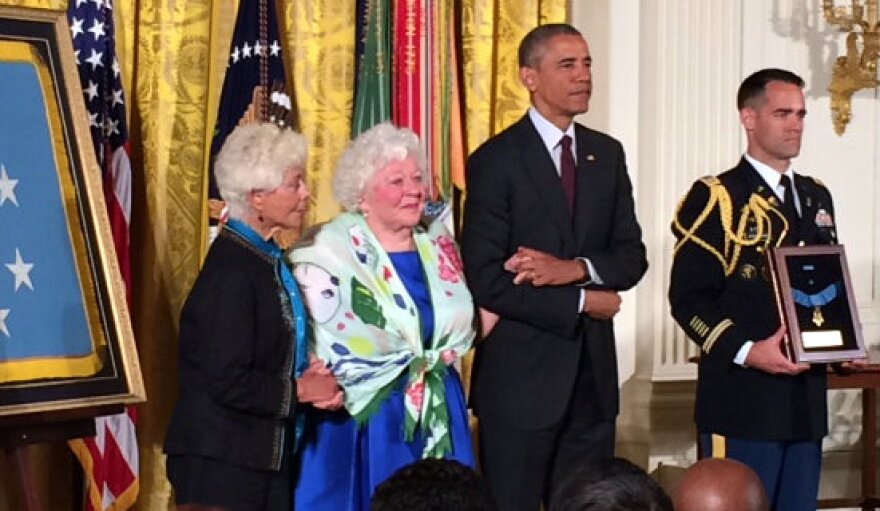 Ina Bass and Elsie Shemin-Roth, the daughters of World War I Sgt. William Shemin, accept the Medal of Honor from President Barack Obama.