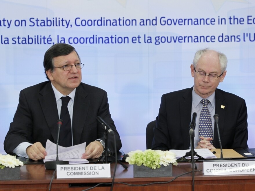 European Commission President Jose Manuel Barroso (left) and European Union President Herman Van Rompuy open a ceremony to sign an economic treaty Friday.
