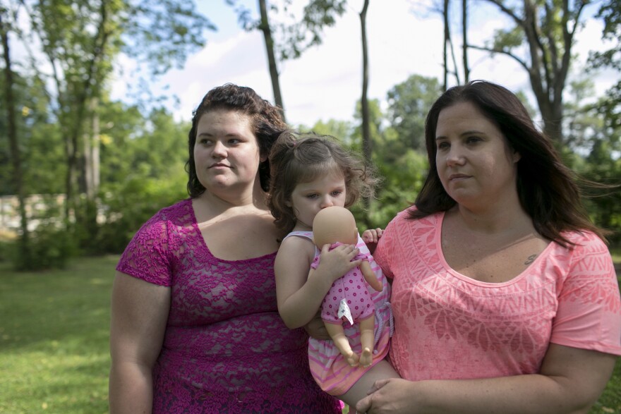 Beth Carey (right) stands in the park with her nieces Jazlen Harden, 3, and Calysta Dildine, 15, in Marion. Chrystina, Beth's twin sister and Jazlen and Calysta's mother, died of a drug overdose in February of 2013.