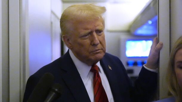 President Donald Trump speaks to reporters aboard Air Force One en route from Miami to Joint Base Andrews, Md., Monday, Jan. 27, 2025. (AP Photo/Mark Schiefelbein)