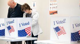 Voters look over their ballots at a polling location during early voting in Columbia, South Carolina. Sean Rayford / Getty Images