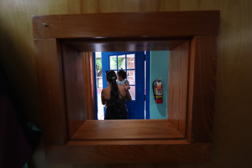 A mother picks up her young child from a Head Start preschool in Immokalee, Fla., Thursday, Sept. 10, 2026.