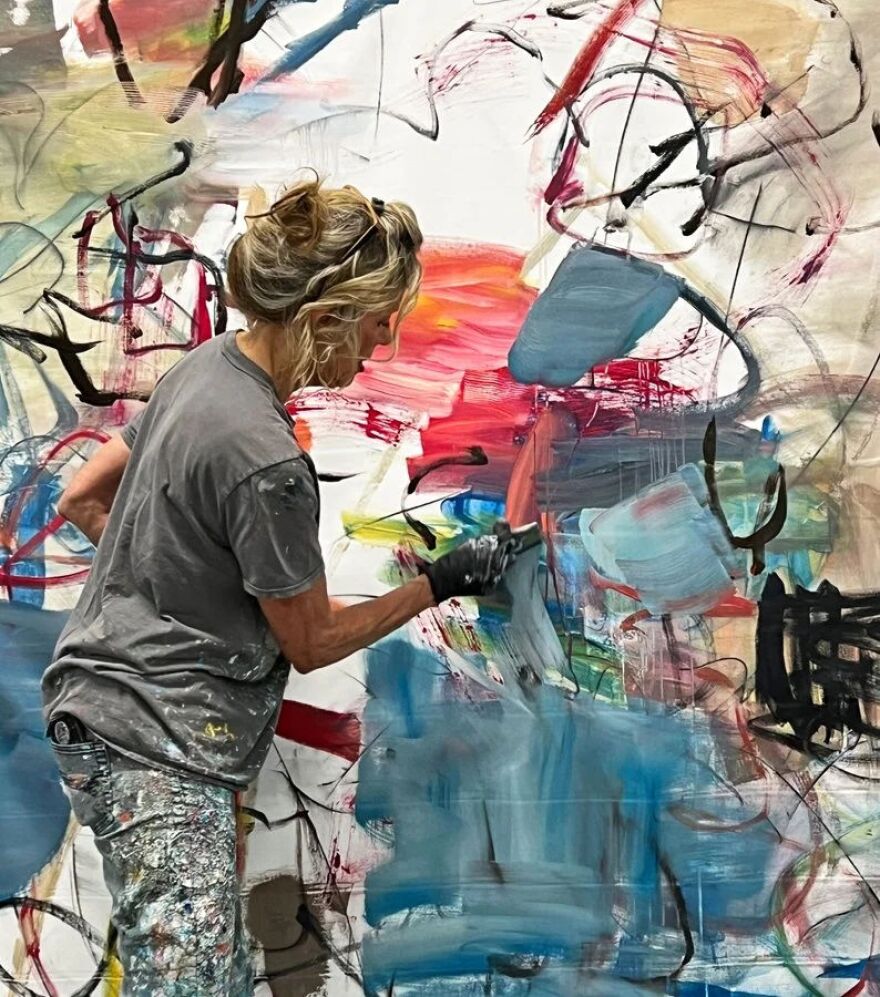 Tesla at work on a painting.