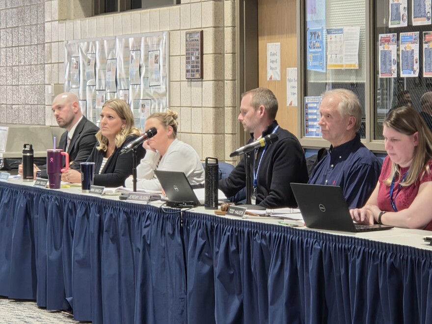 From left, Bemidji Area School Board members Jack Aakhus, Jenny Frenzel and Anna Manecke; Bemidji Superintendent Jeremy Olson; Bemidji School Board Chair Todd Haugen and Administrative Assistant Kristy Settle during a public hearing at Bemidji High School on March 24, 2026.