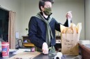 Presley Busenbarrick fills a bag for pick-up at 5th Street Mercantile in downtown Atchison.