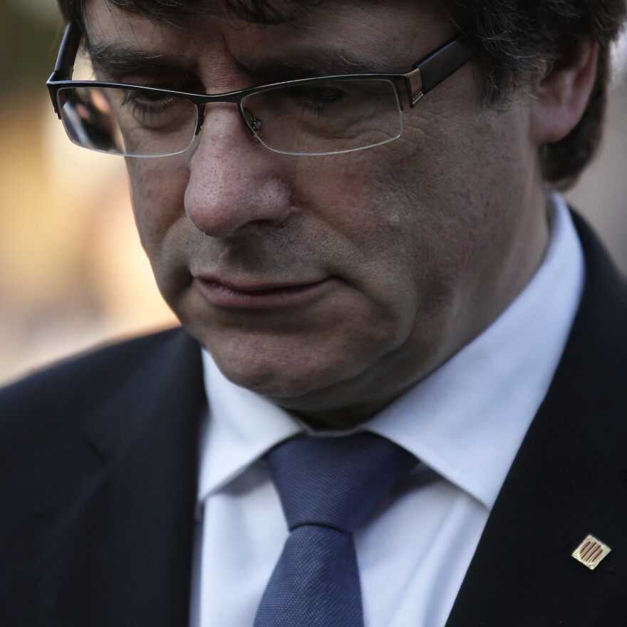 Catalan regional President Carles Puigdemont attends a ceremony commemorating the 77th anniversary of the death of Catalan leader Lluis Companys at the Montjuic Cemetery in Barcelona, Spain, on Sunday.