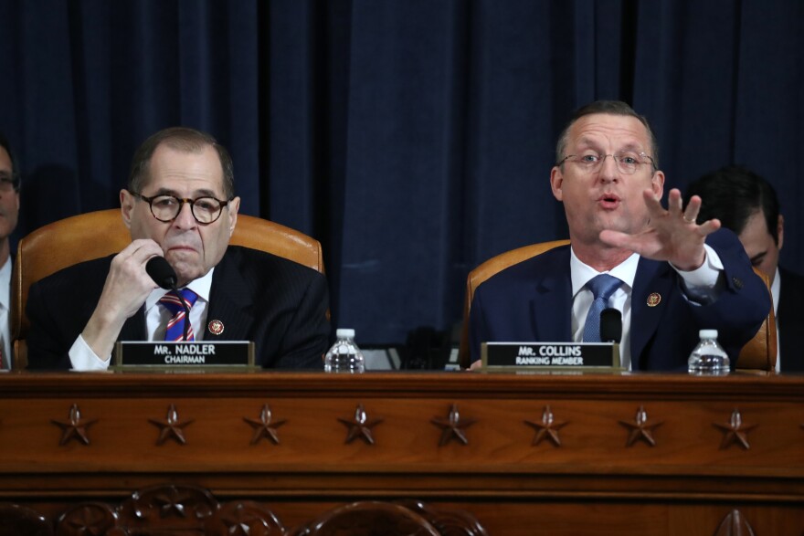 House Judiciary Committee Chairman Jerry Nadler (left), D-N.Y., looks on Wednesday as ranking member Doug Collins, R-Ga., speaks before an impeachment hearing where constitutional scholars are testifying about the impeachment inquiry into President Trump.