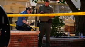 Sheriff's deputies investigate a shooting scene outside the Montgomery County Courthouse, Wednesday, May 13, 2026, in Clarksville, Tenn.
