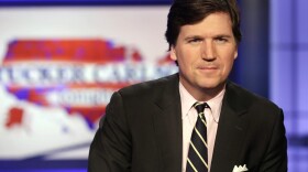 Tucker Carlson poses for photos in a Fox News Channel studio, in New York, Thursday, March 2, 2107. (Richard Drew/AP)