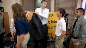 Secretary of Education Arne Duncan talks with students in the library at Tincher Preparatory School in Long Beach, Calif., March 22, 2011. Tincher Preparatory School, a K-8 public school where more than 50 percent of the students are designated as disadvantaged, has been recognized for its gains in test scores.