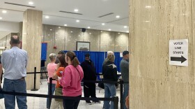 Early voters wait in line at the Rousseau Center in downtown Fort Wayne ahead of election day.
