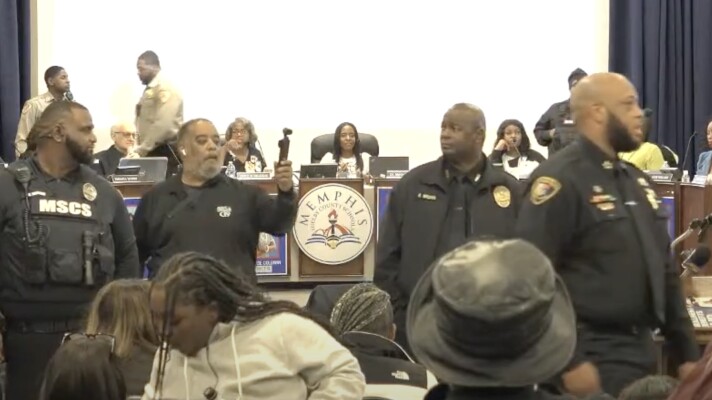 MSCS Superintendent Marie Feagins, center, attends a chaotic school board meeting Jan. 21 marked by crowd disruptions and a heavy police presence. In the final hour, the board terminated her contract.