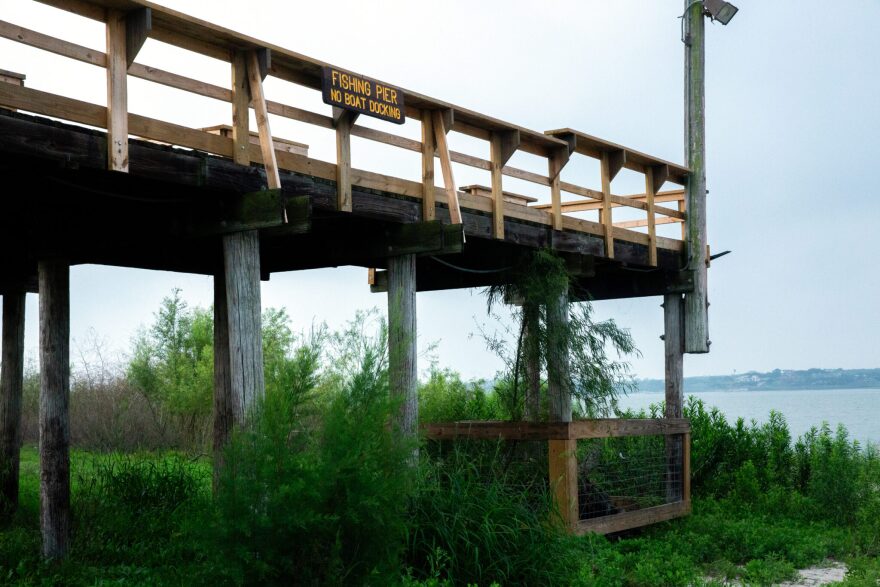 Water sits 30 or more feet below the base of a fishing pier at Lake Corpus Christi on April 28.