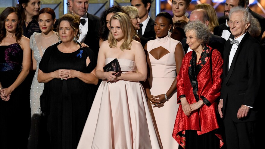The cast and crew of <em>The Handmaid's</em> <em>Tale — </em>including Emmy winners Ann Dowd and Elisabeth Moss, actress Samira Wiley, and author Margaret Atwood — onstage during the 69th Primetime Emmy Awards.