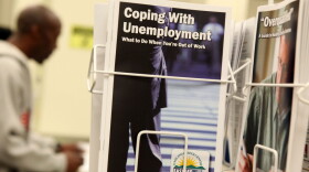 Pamphlets with information about unemployment are displayed in a career center in Oakland, Calif.