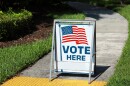 VOTE HERE SIGN placed on the walkway to a neighborhood polling place, as seen on election day in Fort Lauderdale, Florida.