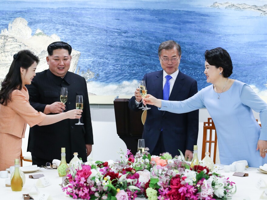 Kim and his wife, Ri Sol Ju (left), share a toast with Moon and his wife, Kim Jung-sook, during the official dinner at the end of their historic summit Friday.