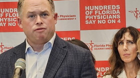 Jason Weida, secretary of the Florida Agency for Health Care Administration, stands alongside Physicians Against Amendment 4 speaking about the dangers the agency and the group believe regarding a November ballot measure that would codify abortion protections into the state constitution.