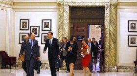 Former U.S. Attorney Robert McCampbell, second from left, who represents Phillip Morris USA Inc., R.J Reynolds Tobacco Co. and others, leaves the Oklahoma Supreme Court on August 8, 2017.