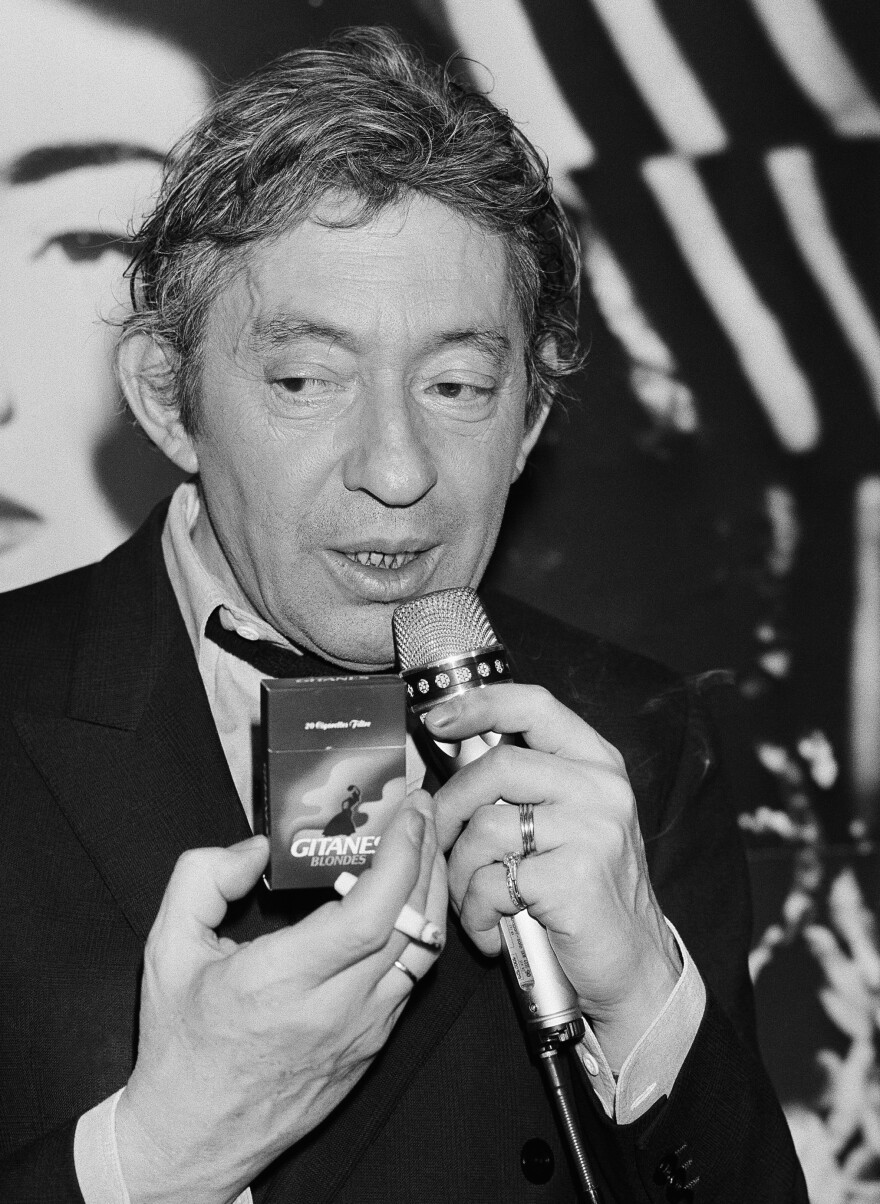 French singer, composer and well-known smoker Serge Gainsbourg presents the new Gitane Blonde cigarette at a press conference at Paris hotel George V, on April 29, 1986.