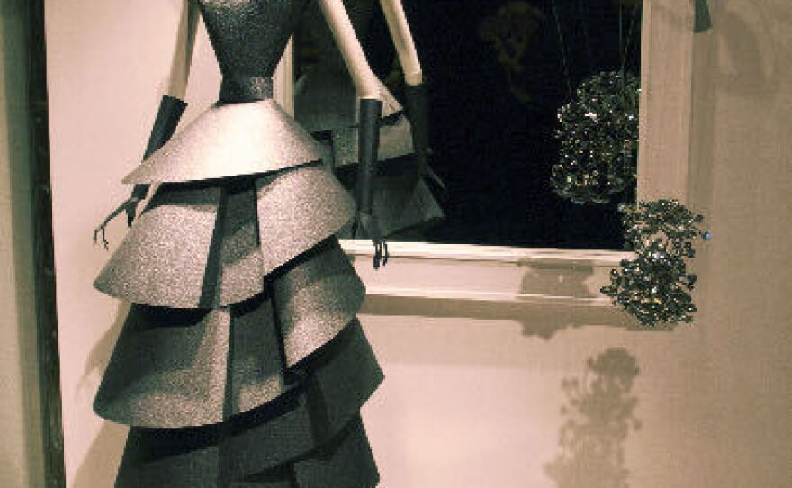 Reproductions of Neiman Marcus ads from 1948 in paper sculpture, 2007.