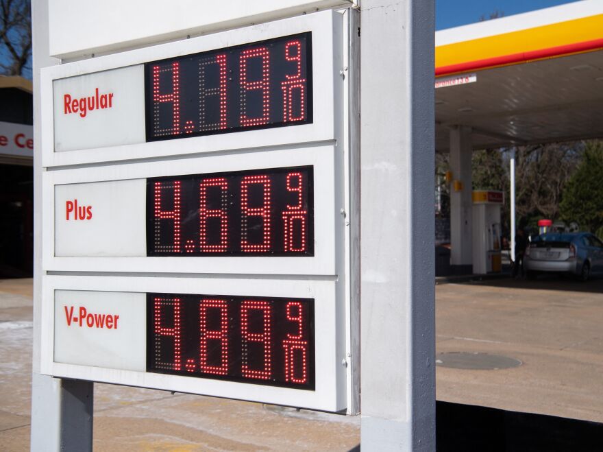A sign displays fuel prices at a gas station in Arlington, Va., on March 16. President Biden announced on Thursday the country's largest-ever release from its Strategic Petroleum Reserve. [Saul Loeb / AFP via Getty Images]