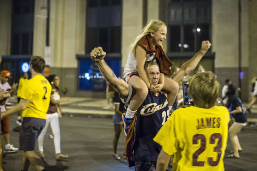 Cleveland Cavaliers fans celebrate in the street after the Cavs defeated the Golden State Warriors to win the NBA Championship.