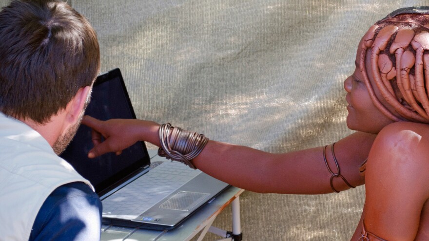 A woman from the Twe tribe tests her ability to mentally rotate an item on a laptop computer. In the battle of the sexes, researchers in the Namibia study found men to be the better mental rotaters.