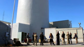 Corps of Engineers staff and Army officials assemble outside the SM-1A during a 2021 site visit. The U.S. military started construction on the small nuclear power plant in 1958 to test whether it could provide heat and power more cheaply and reliably than diesel-fired generators. It generated up to 20 megawatts of heat energy and 1.6 megawatts of electricity. But the Army encountered several problems with the SM-1A, and it was shut down in 1972. The reactor areas were encased in concrete and secondary systems that were used to generate steam and heat were converted to again operate with diesel-fueled boilers.