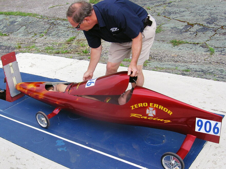 Dave Berndt closes up the fuselage on his daughter Jamie's racer. The tight fit helps racers be more aerodynamic.
