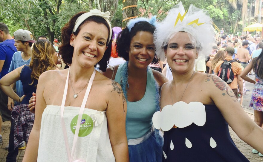 Renata Cabral (left), Luciana Figueredo (right) and a friend dressed in water-themed costumes at a pre-Carnival block party in Sao Paulo. "It's Carnival and we can't forget it's a reality the water is finishing and we have to do something," said Cabral.