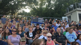 Nearly 2,500 people joined a vigil at Weymouth High School for a police officer and elderly bystander who were shot and killed by a man on Sunday. (Yasmin Amer/WBUR)