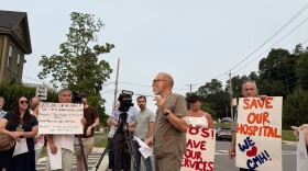 X-ray technician Rob Anderson speaks at a rally outside CMH.