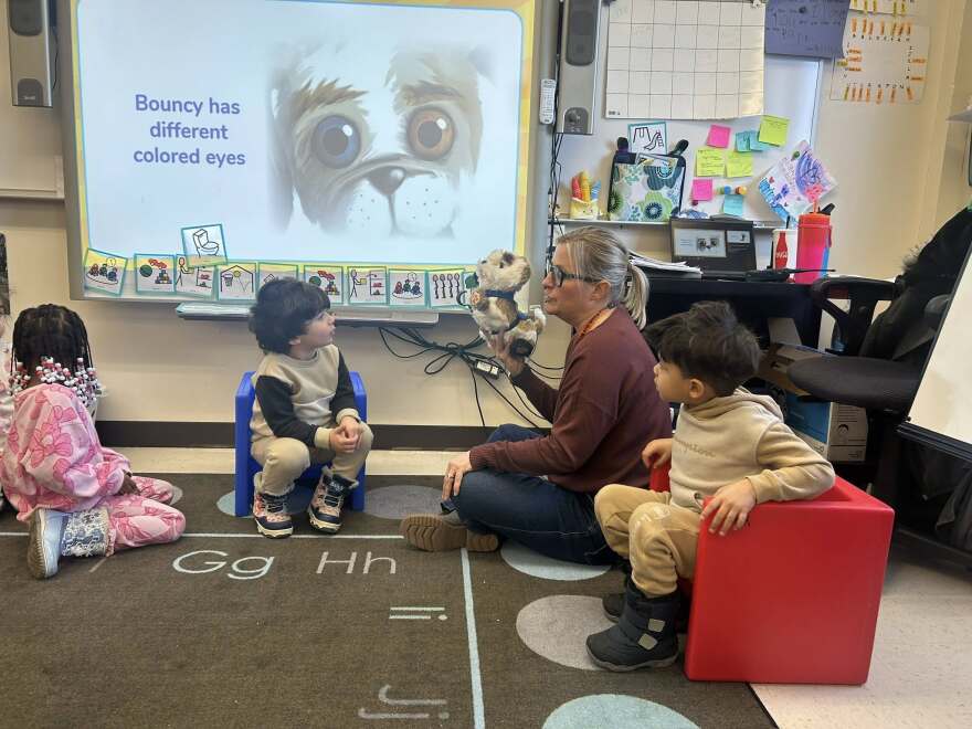 Adrien Fell working with students at DeKalb's Early Learning Development Center
