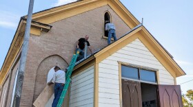 Construction workers restore historic Methodist church in Corinne.