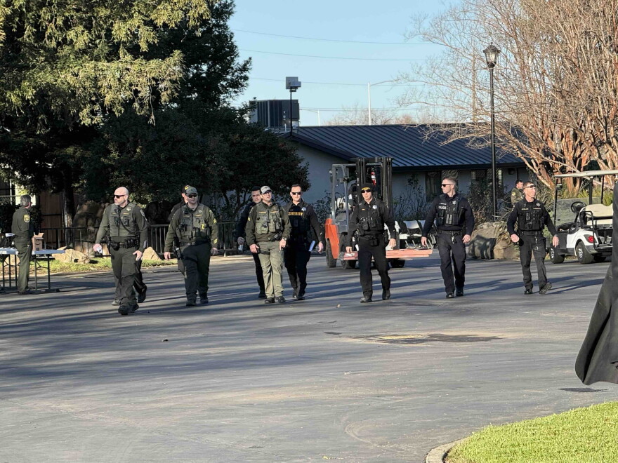 Law enforcement officers patrol the memorial for Congressman Doug LaMalfa on Jan. 24, 2026, in Chico.