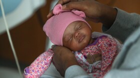 Yonique Jackson holds her 38-week-old daughter, Gy’dence, after feeding her in the NICU at Rochester General Hospital, where she gave birth via cesarean section. RGH held a press conference Thursday, November 11, 2025, to announce its designation as a “Baby Friendly” hospital. The designation reflects improvements in maternity care, including the hospital’s success in safely reducing C-section rates and improving outcomes for mothers and babies.