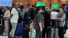Passengers in line at a ticket counter at SAT