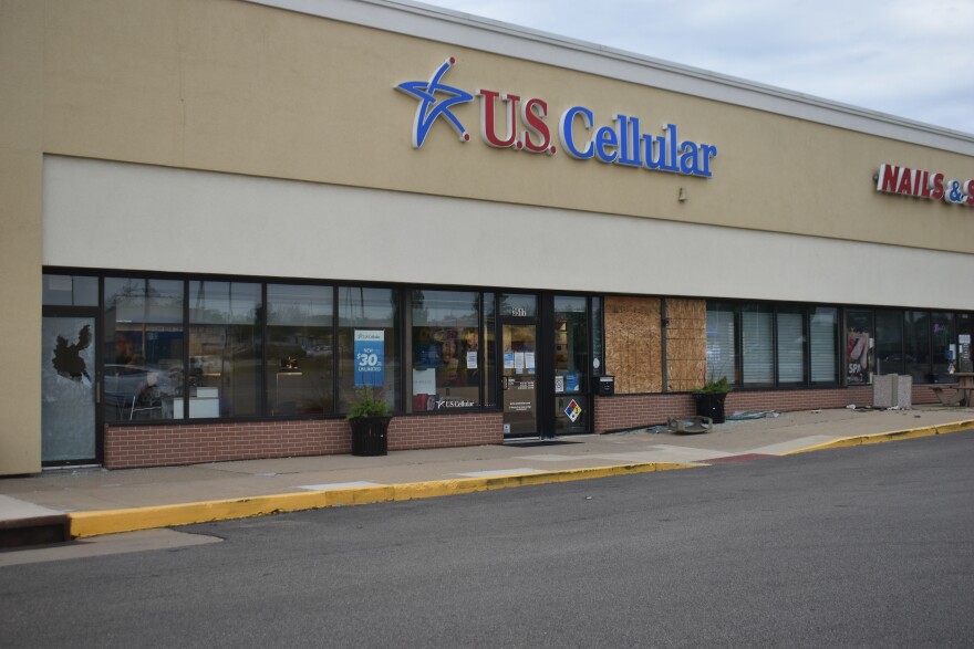 Damage at the U.S. Cellular store on University early Monday morning.