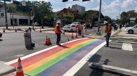 Construction crews reinstate the rainbow crosswalks in Montrose on October 1, 2025, after being removed for construction.